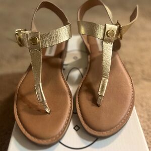 Gold metallic sandals.